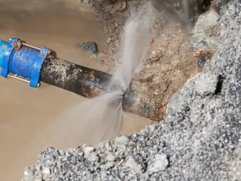Water spraying out of a split supply pipe